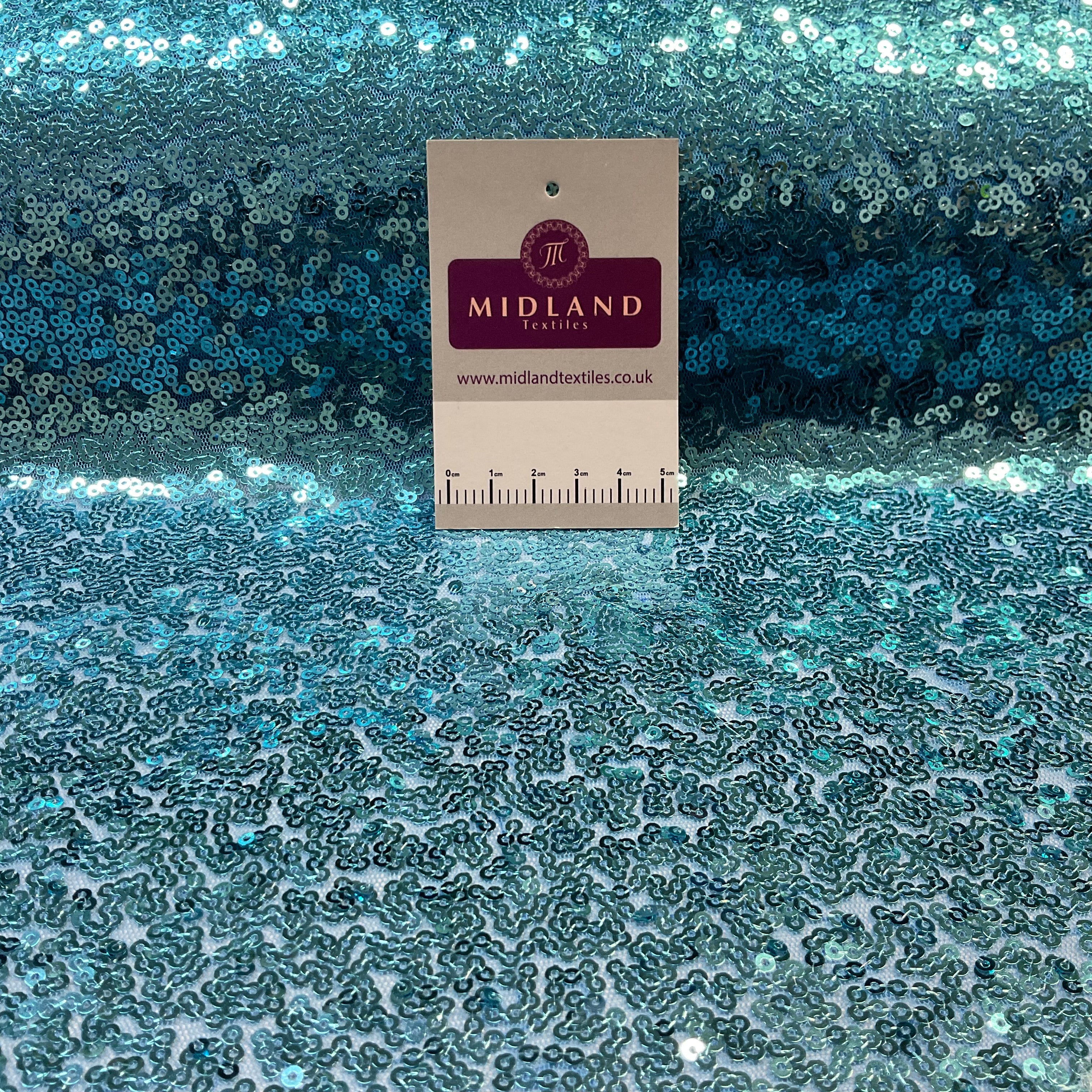 SENSATIONAL 3MM SEW ON ALL OVER SEQUINS ON NET FABRIC 50' WIDE DRESS FABRIC M1797 MTEX