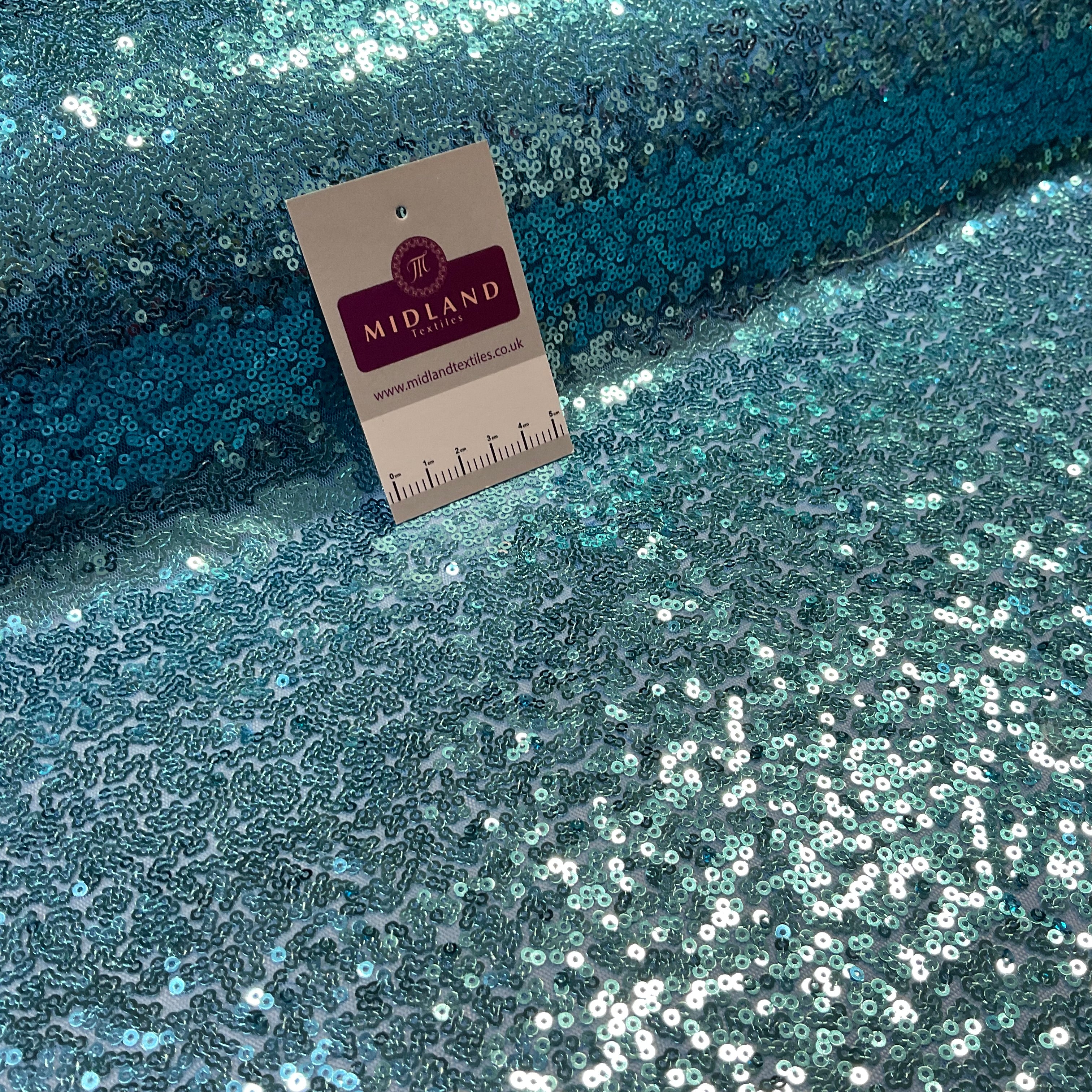 SENSATIONAL 3MM SEW ON ALL OVER SEQUINS ON NET FABRIC 50' WIDE DRESS FABRIC M1797 MTEX