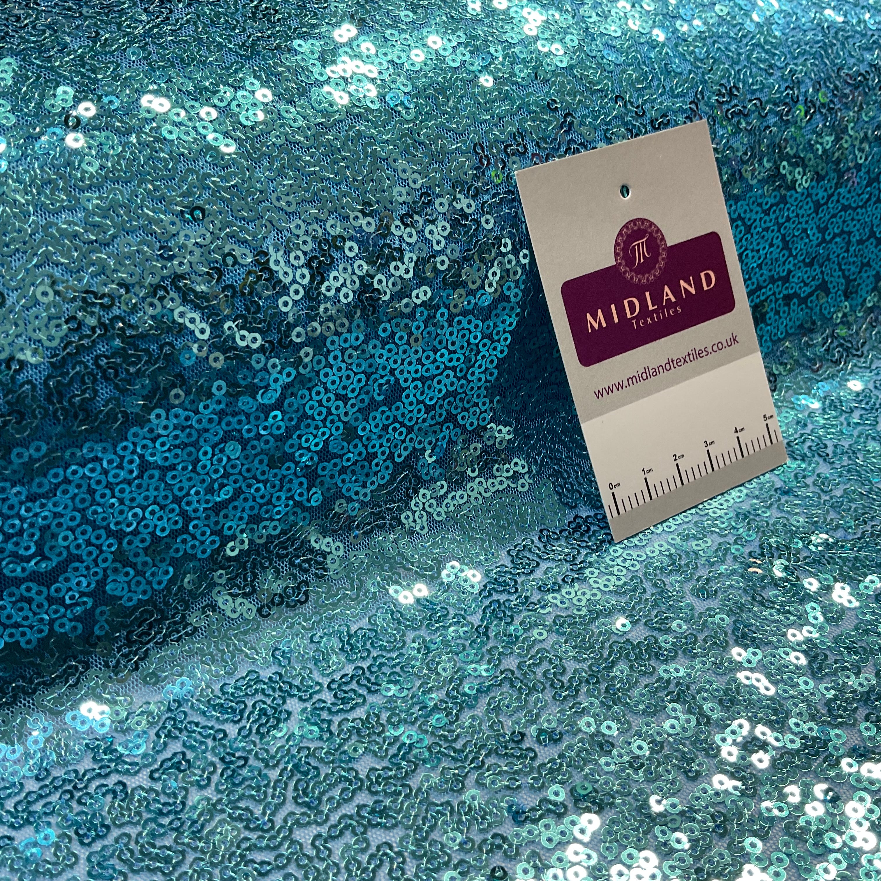 SENSATIONAL 3MM SEW ON ALL OVER SEQUINS ON NET FABRIC 50' WIDE DRESS FABRIC M1797 MTEX