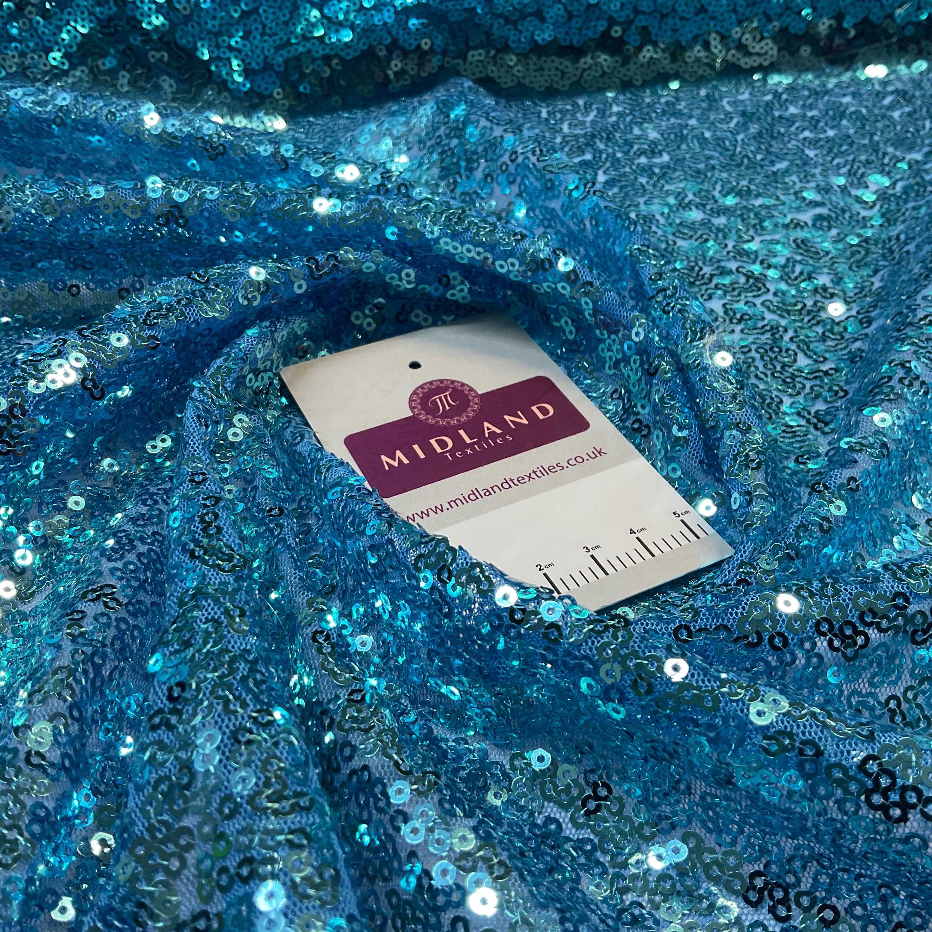 SENSATIONAL 3MM SEW ON ALL OVER SEQUINS ON NET FABRIC 50' WIDE DRESS FABRIC M1797 MTEX