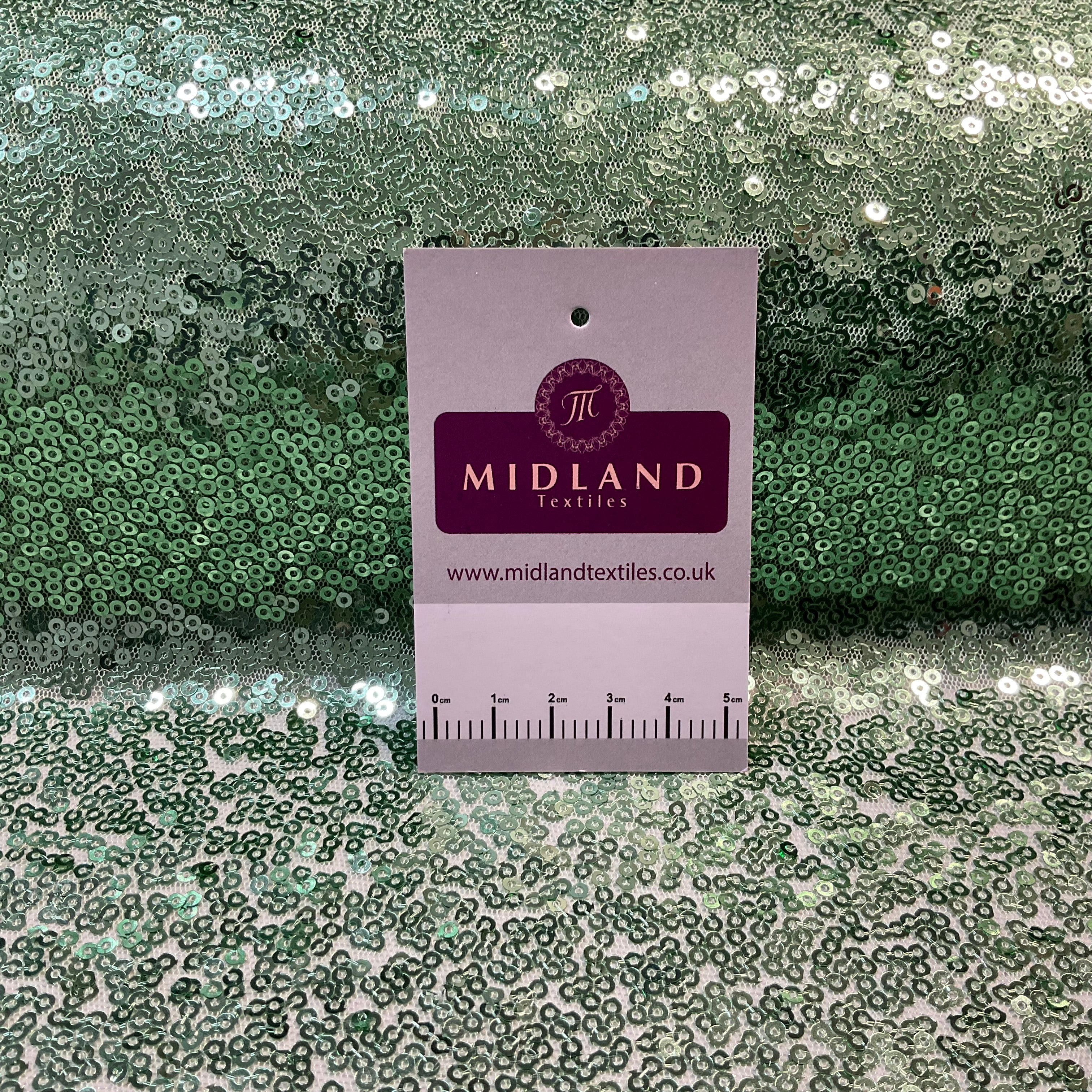 SENSATIONAL 3MM SEW ON ALL OVER SEQUINS ON NET FABRIC 50' WIDE DRESS FABRIC M1797 MTEX