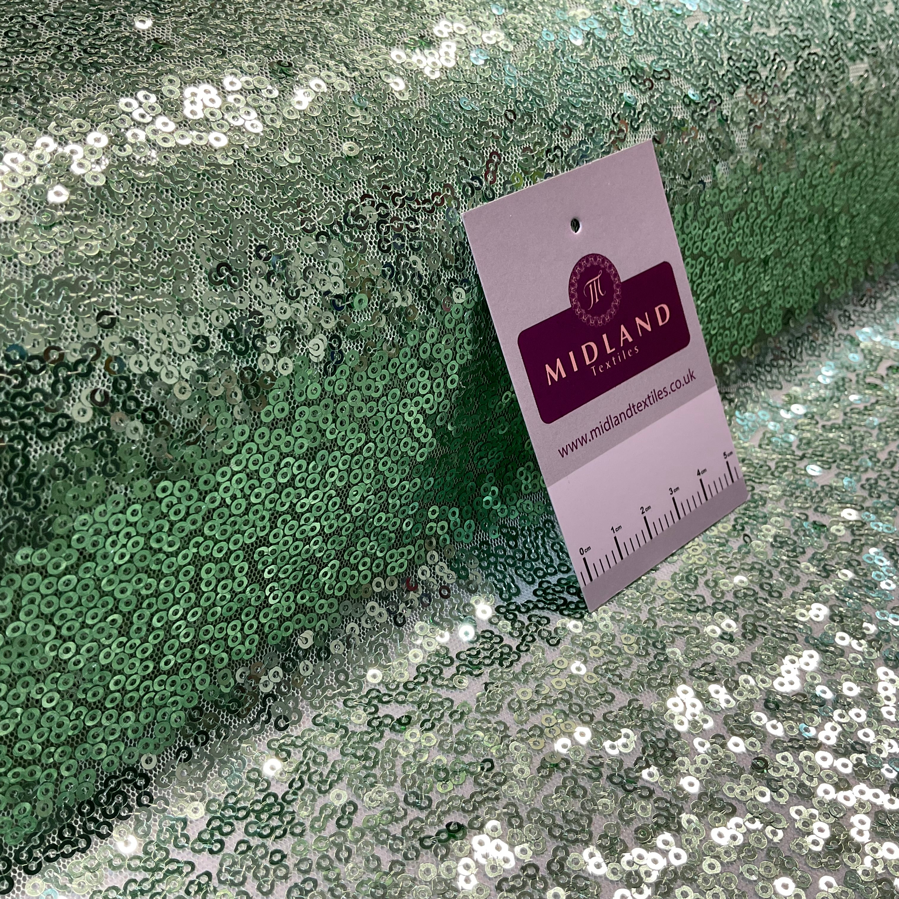 SENSATIONAL 3MM SEW ON ALL OVER SEQUINS ON NET FABRIC 50' WIDE DRESS FABRIC M1797 MTEX