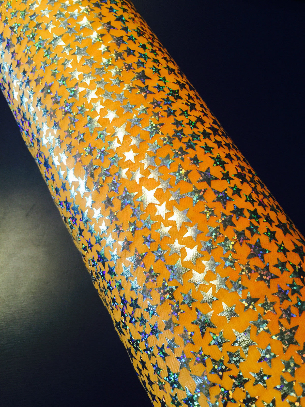 £1.99/m Sliver Hologram Star print on orange Foil Print Stretch Fabric M7-3 Mtex