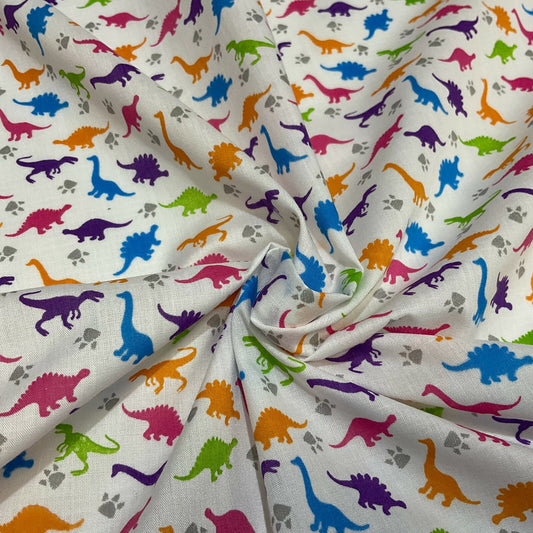 £2.50/m White Tiny Dinosaurs  Children's Poly cotton printed fabric M1637