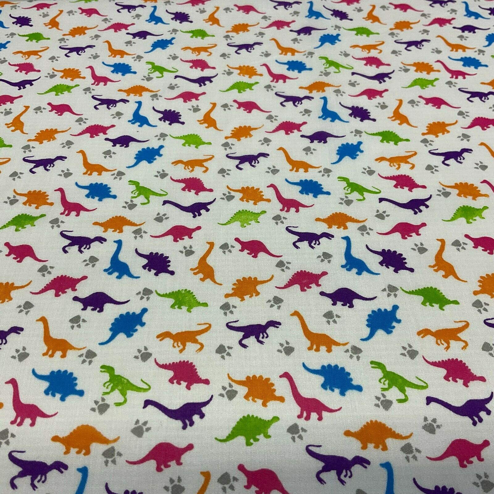 White Tiny Dinosaurs  Children's Poly cotton printed lightweight fabric M1637