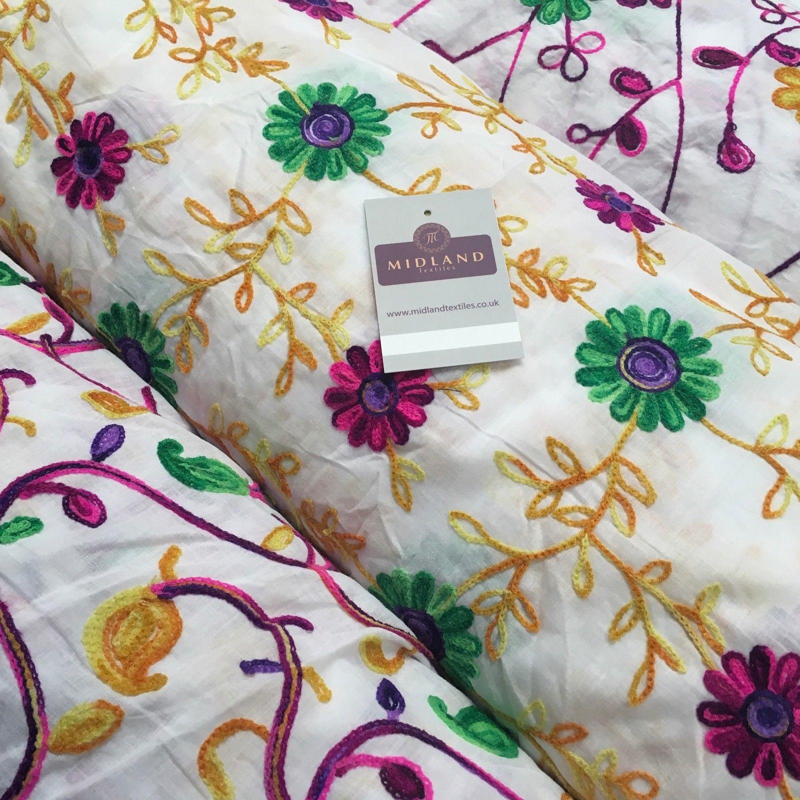 White Cotton with multicoloured wool embroidered dress fabric 54' Wide M1000