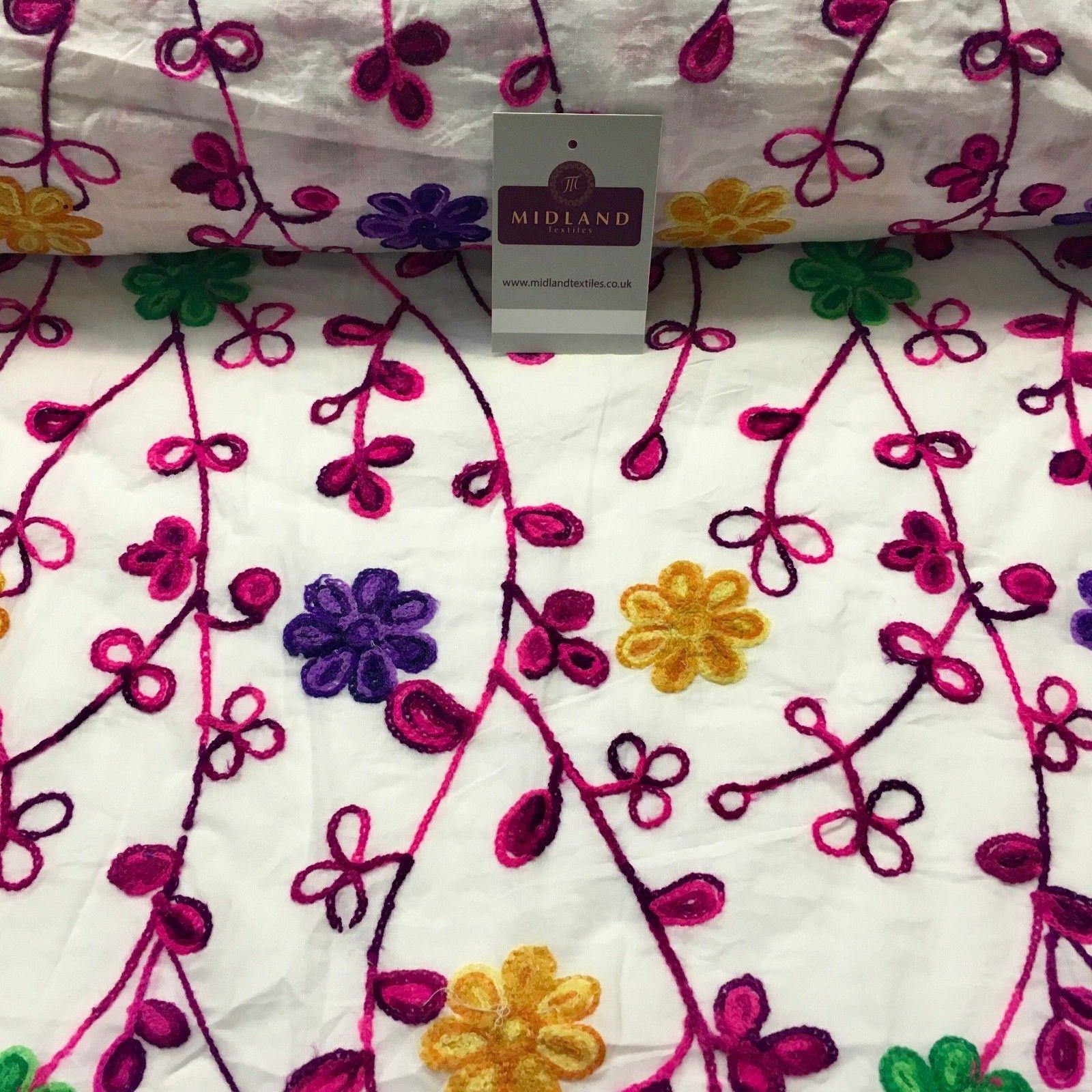 White Cotton with multicoloured wool embroidered dress fabric 54" Wide M1000